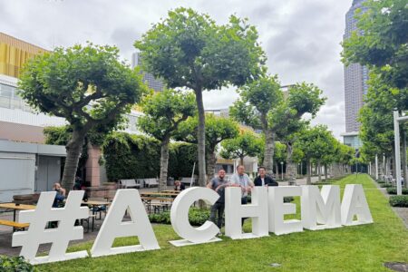 Achema 2024 in Frankfurt am Main Germany - two trade fair fitters and the trade fair organizer